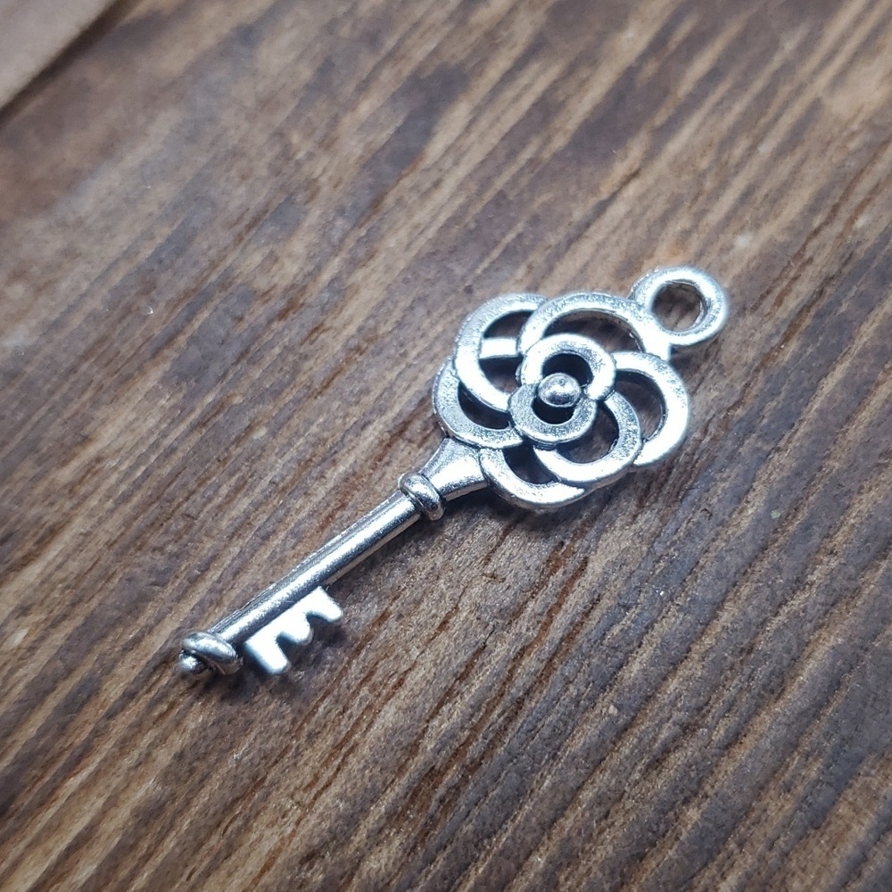 Rose intricate key pendant